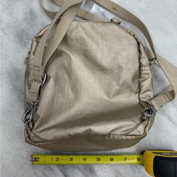 Kipling Gold Backpack with Utilitarian Design